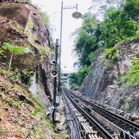 Rock slope netting alongside a funicular railway track cut through rock