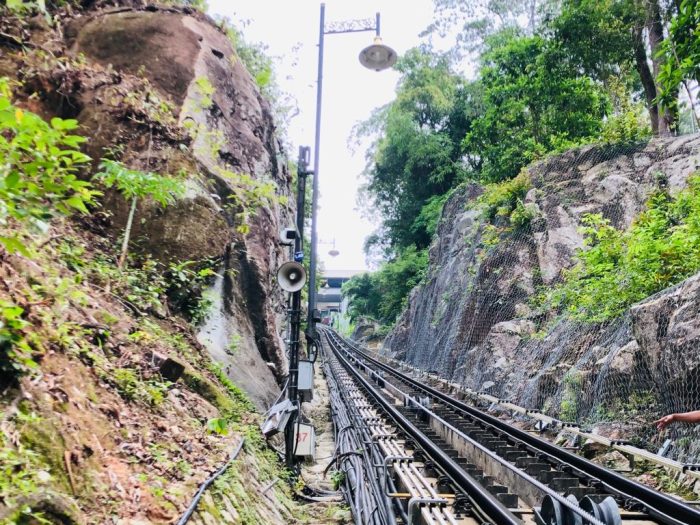 Rock slope netting alongside a funicular railway track cut through rock
