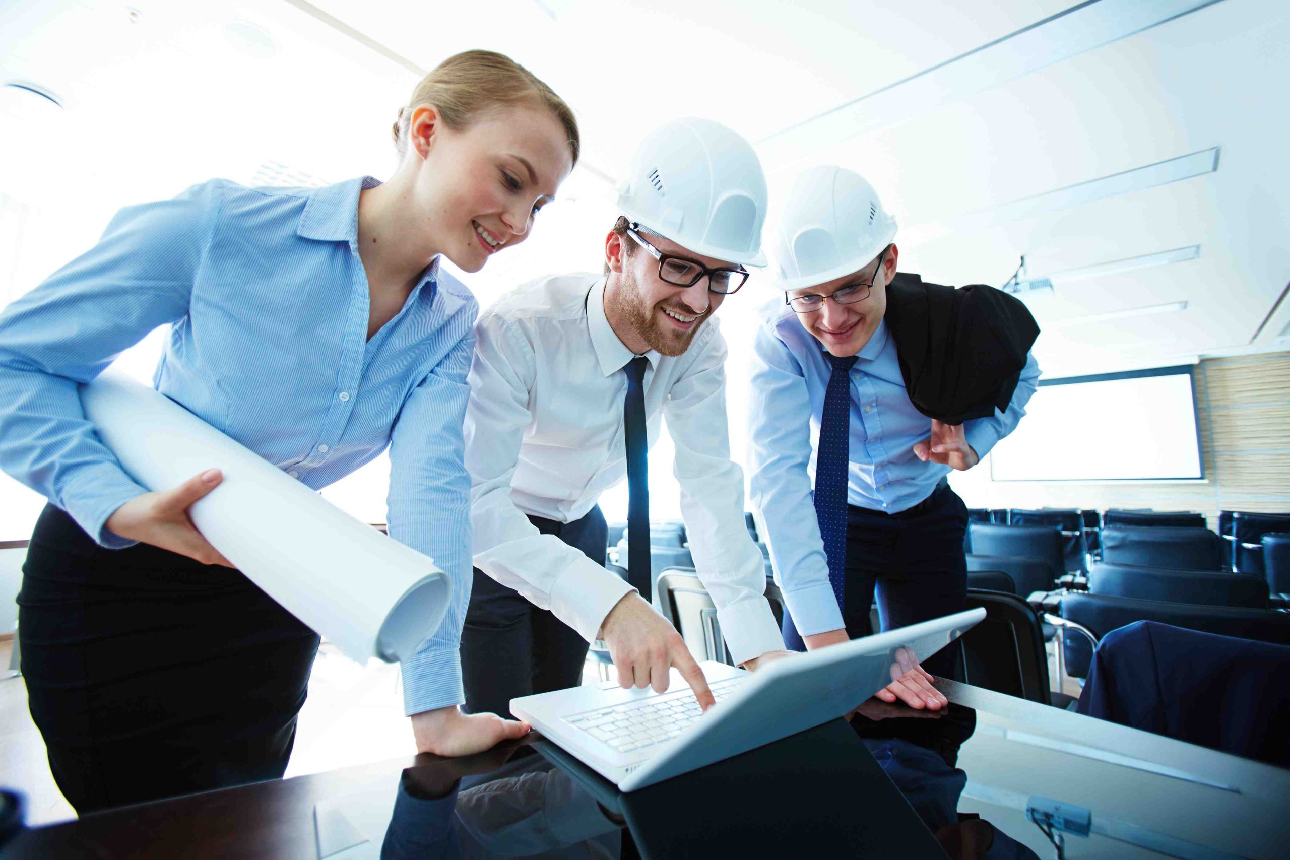 Engineers reviewing a project plan together on a laptop